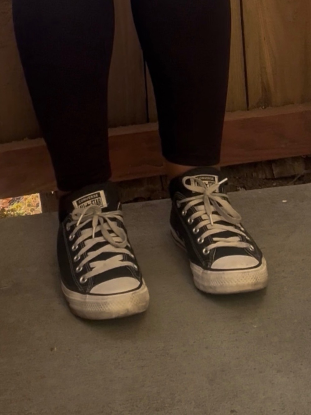 Well worn used Black and white Low Top Converse woman’s size 9